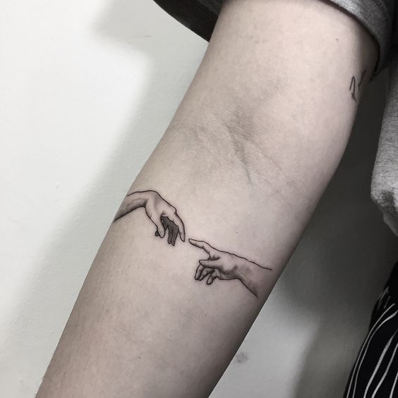 Tatuagens da Mão de Deus e Adão