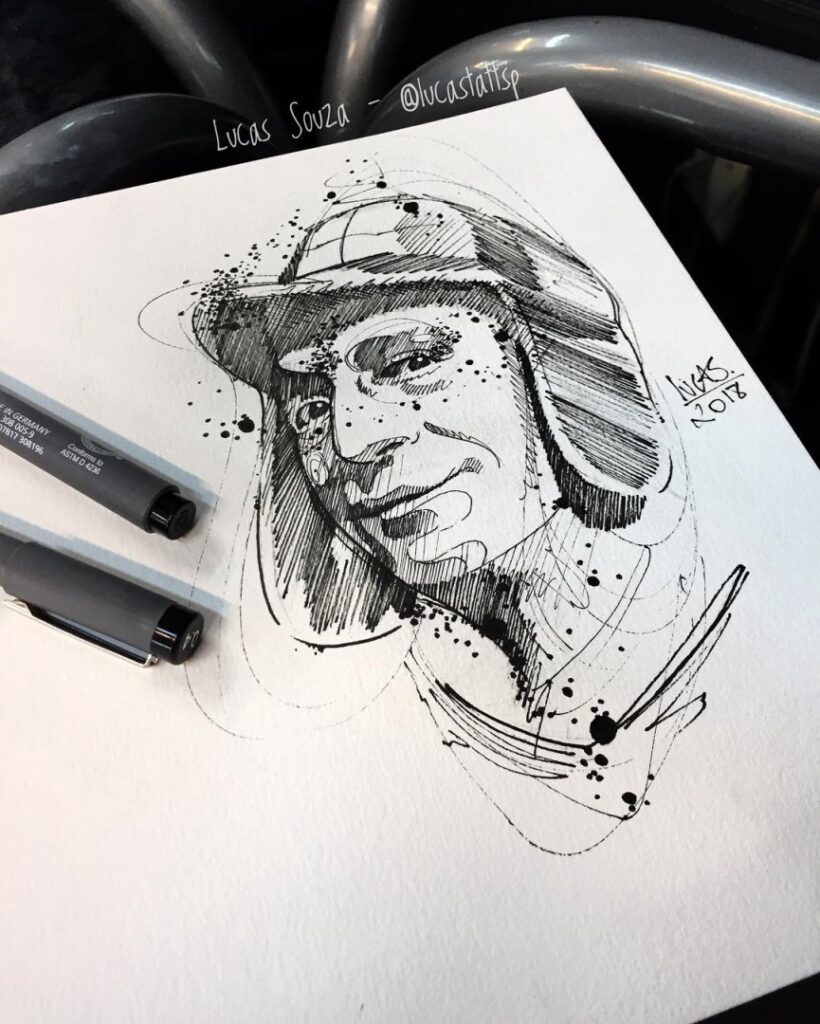 Desenho abstrato em preto e branco de uma figura com gorro. Assinatura de Lucas Souza. Caneta preta ao lado.